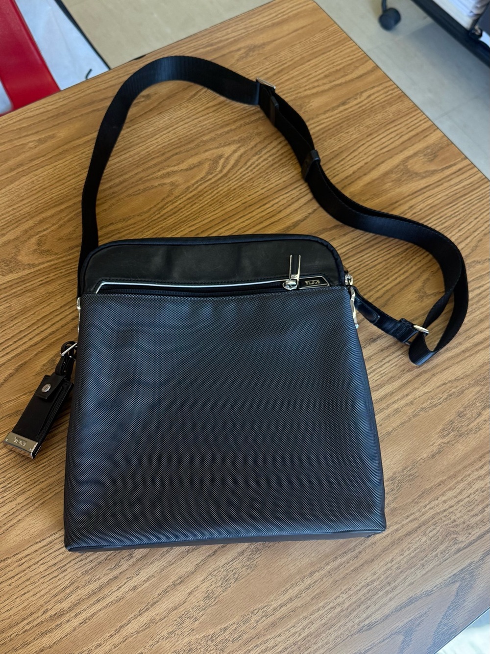 Tumi Arrive Owen Crossbody bag